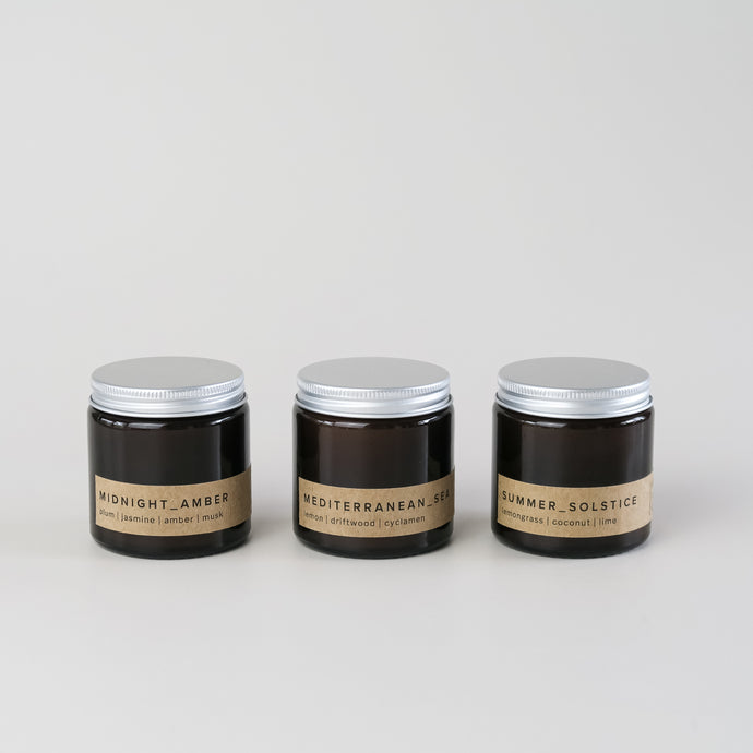 gift set of three small amber jar candles with aluminium lid and minimal brown labels, in bestselling fragrances