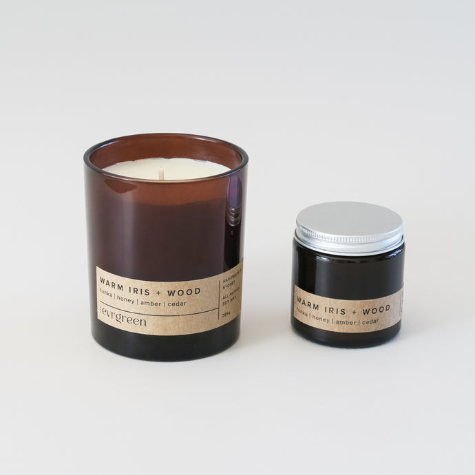 warm iris + wood - with hay, dry tobacco and warm honey displayed - luxury candle left is large 285g amber jar, right is small 120g amber jar with aluminium screw lid